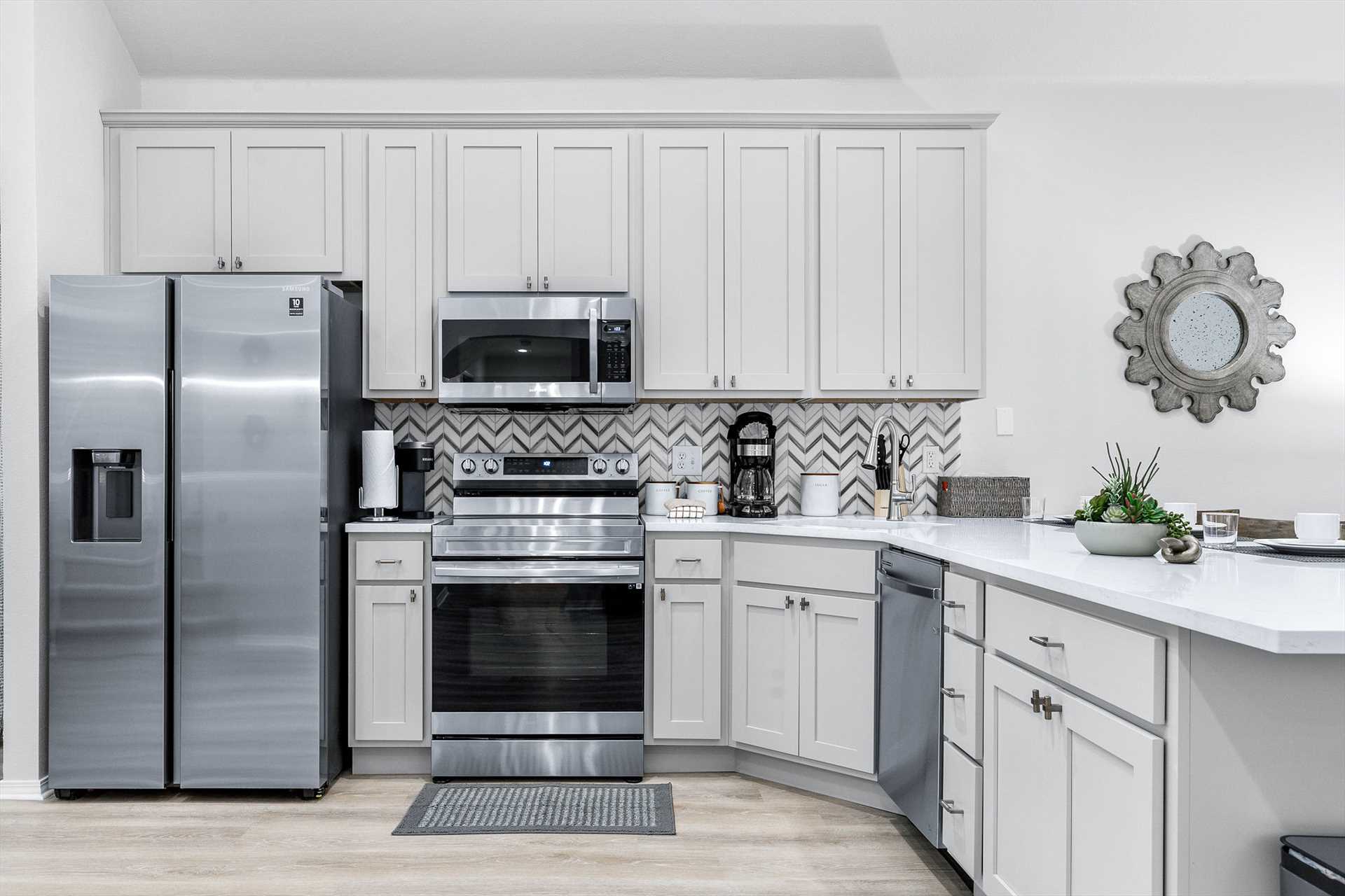 The kitchen has all new cabinets and stainless appliances.