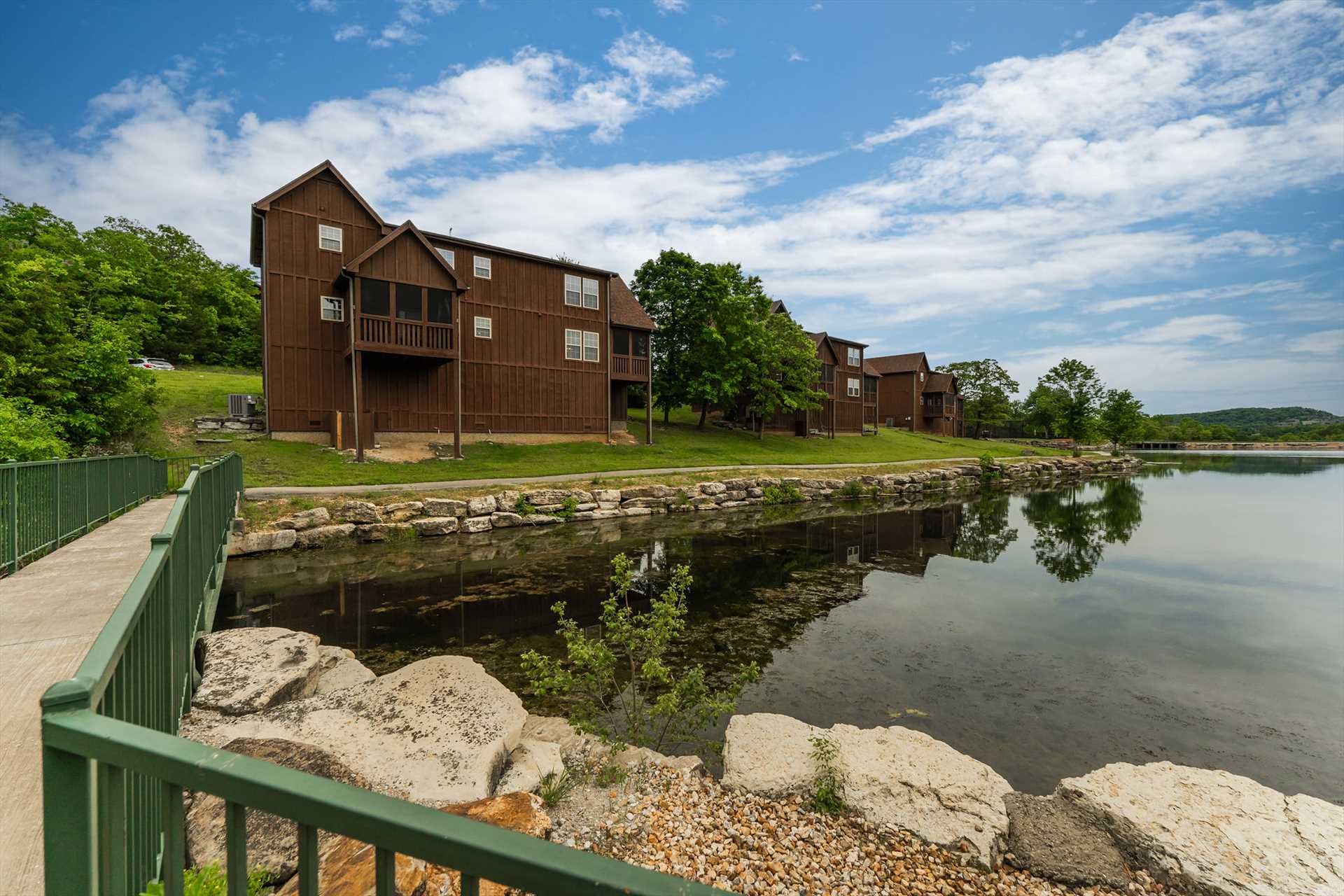 Walk right around the lake from behind the cabin or walk dow