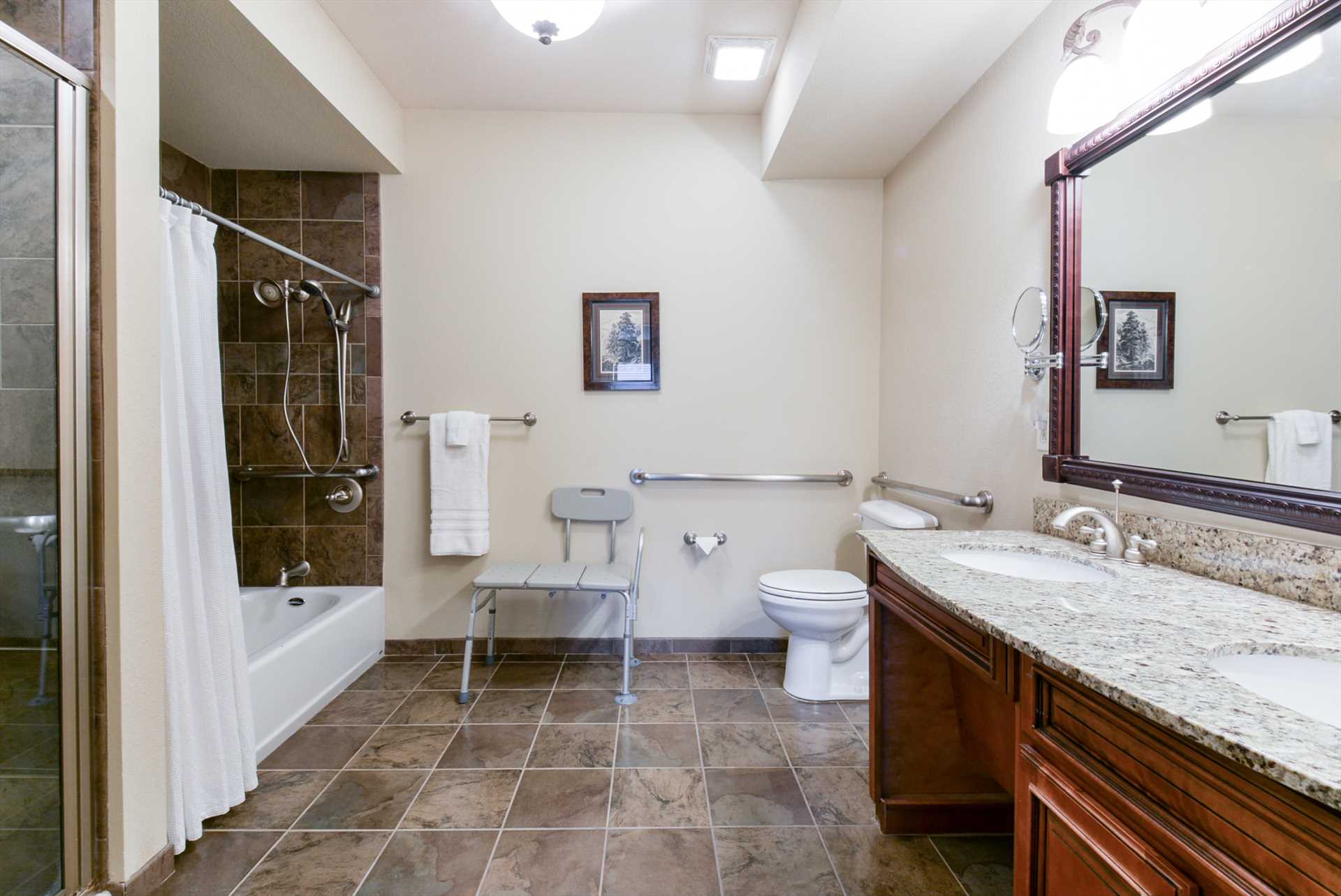 This accessible bathroom includes a combination shower/tub.