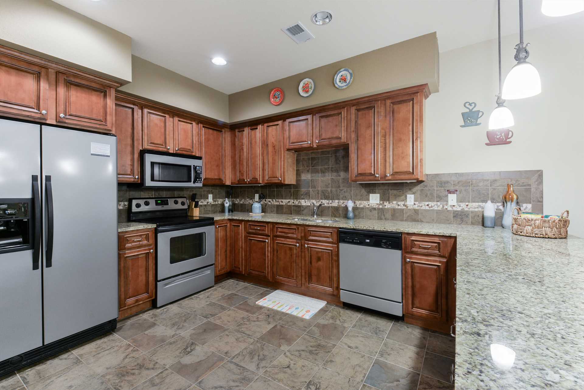 This spacious kitchen comes fully-equipped with everything y