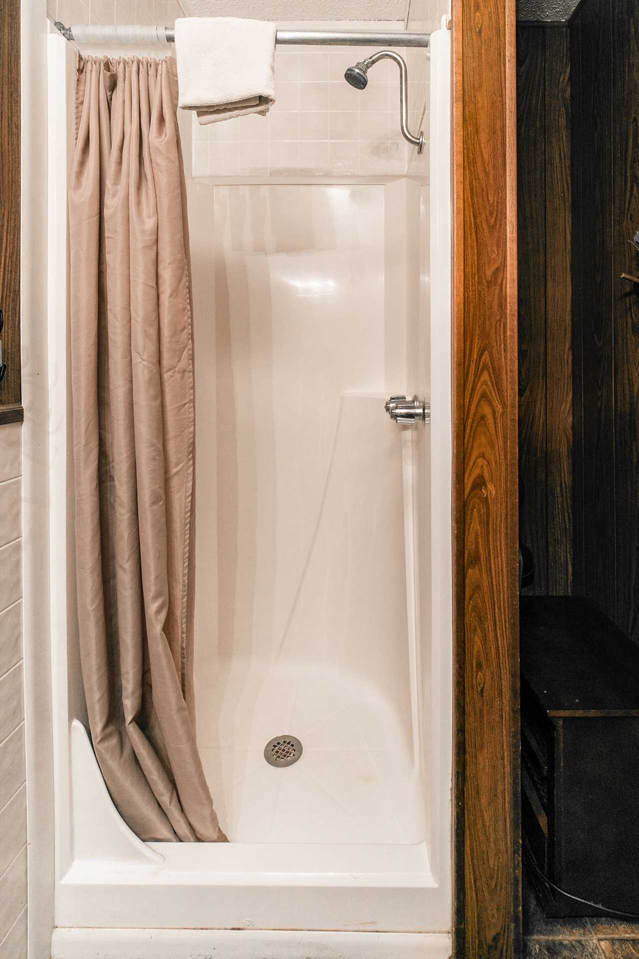 The bathroom has a stall shower. (Cabin 11)