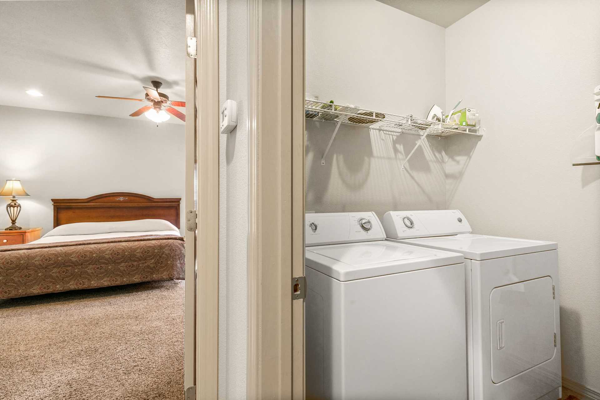 The washer and dryer is centrally located between the bedroo