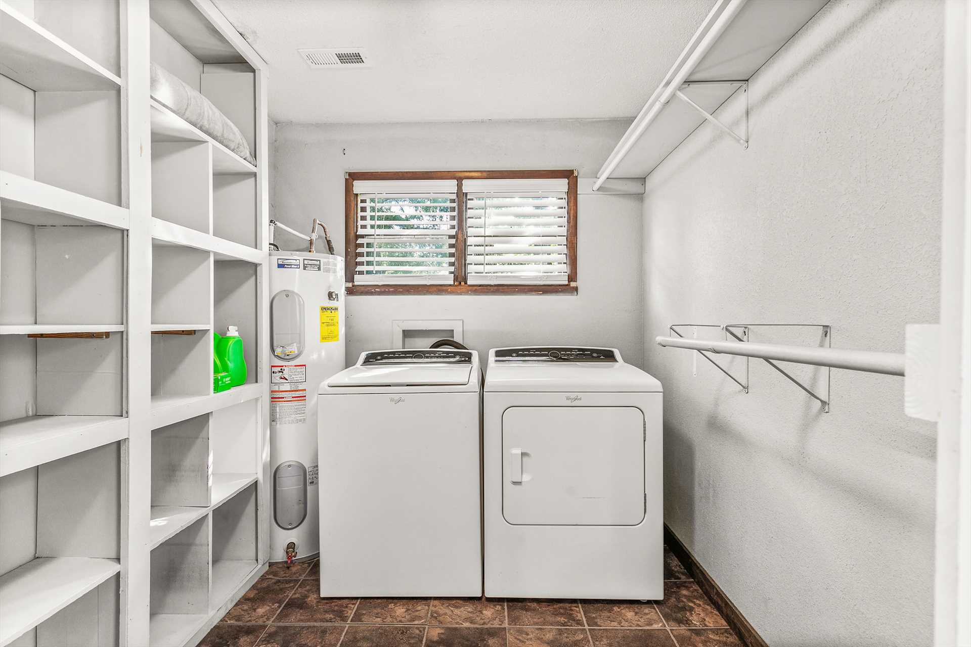 This spacious laundry/ closet area is located off the privat