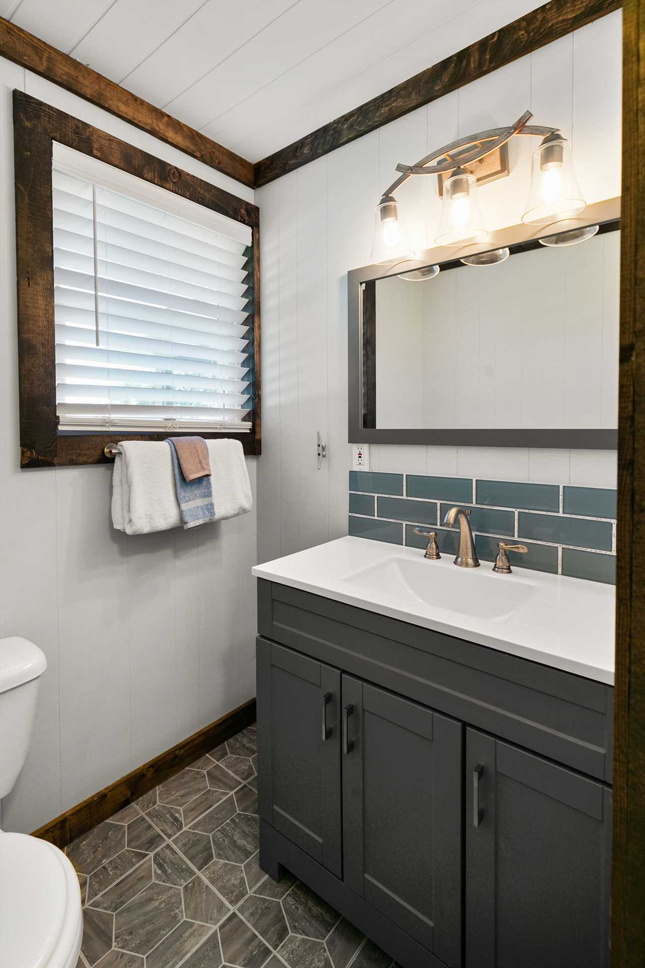This bathroom has plenty of storage space with the attached 