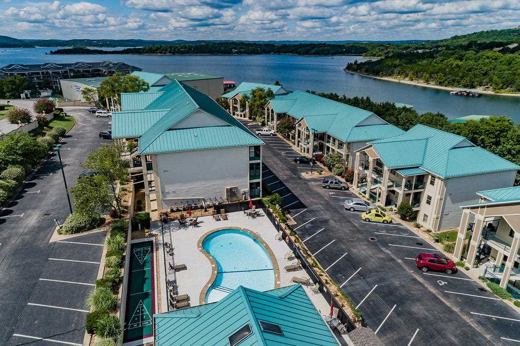 The building is right next to the pool.