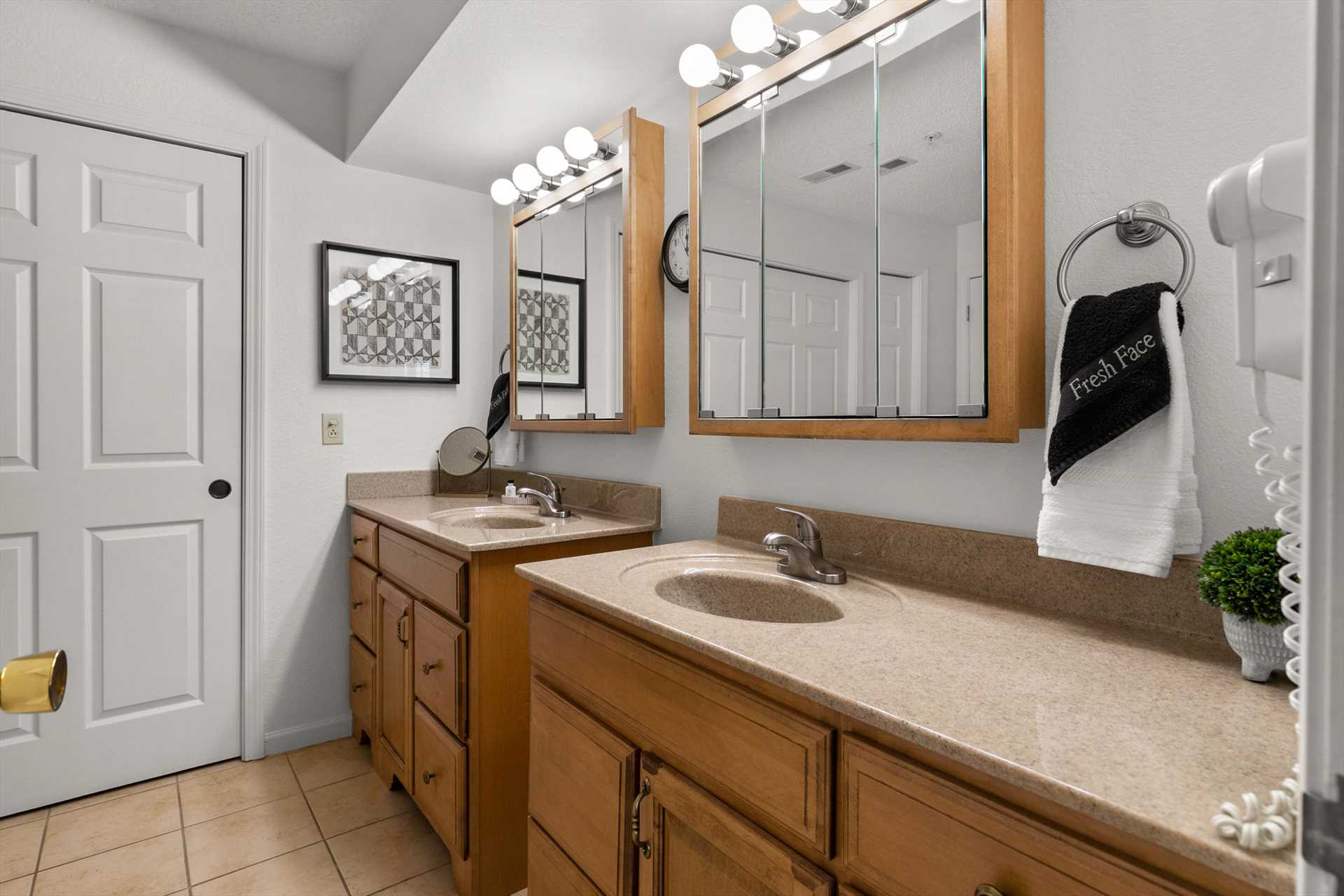 The large bathroom has two vanities.