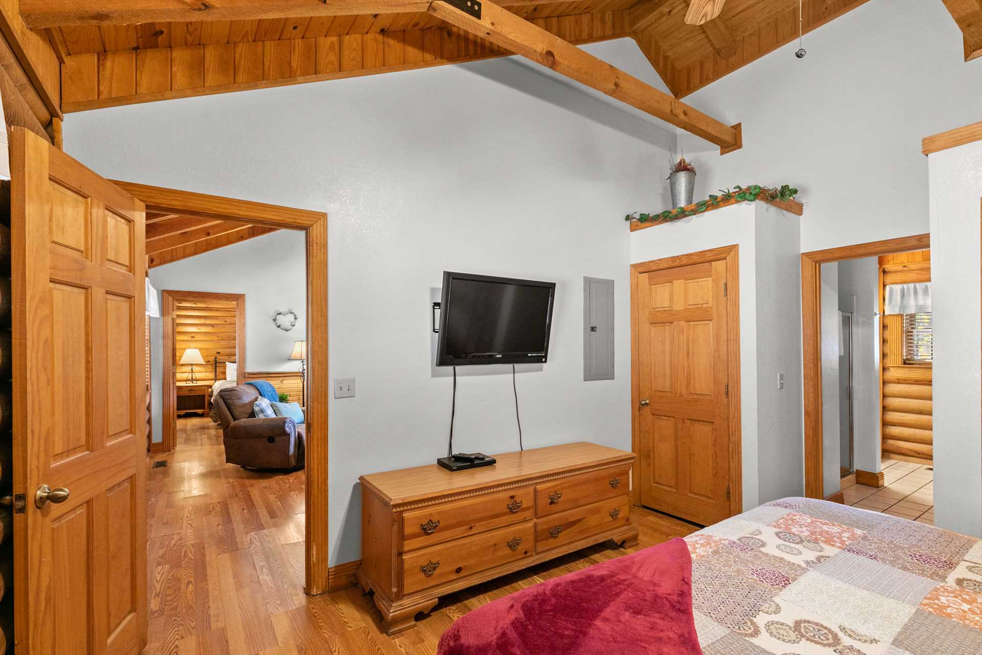 A stacked washer and dryer is located just inside the closet