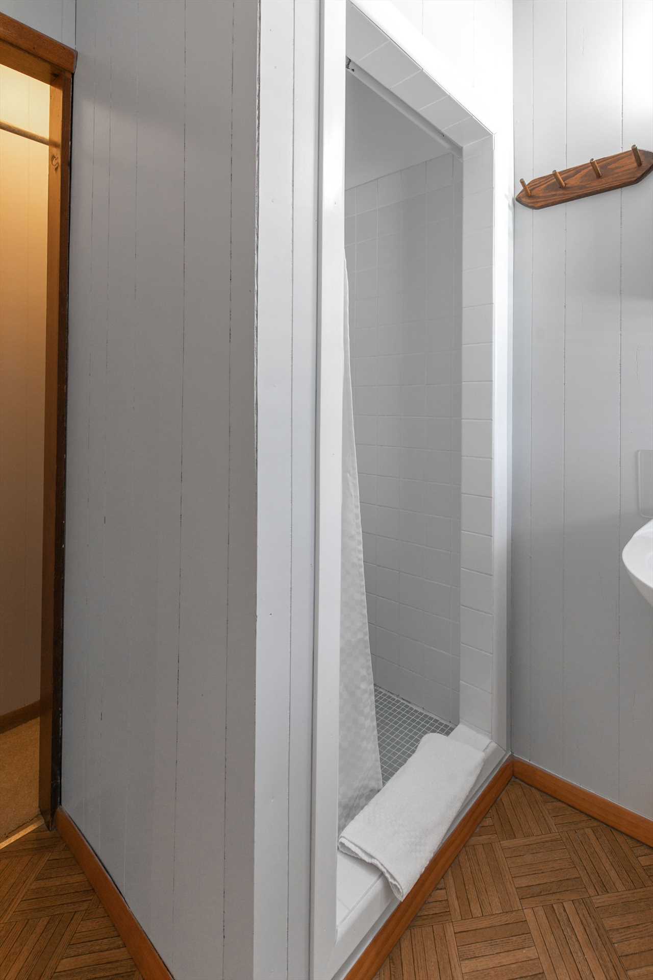 This unit has a stall shower.