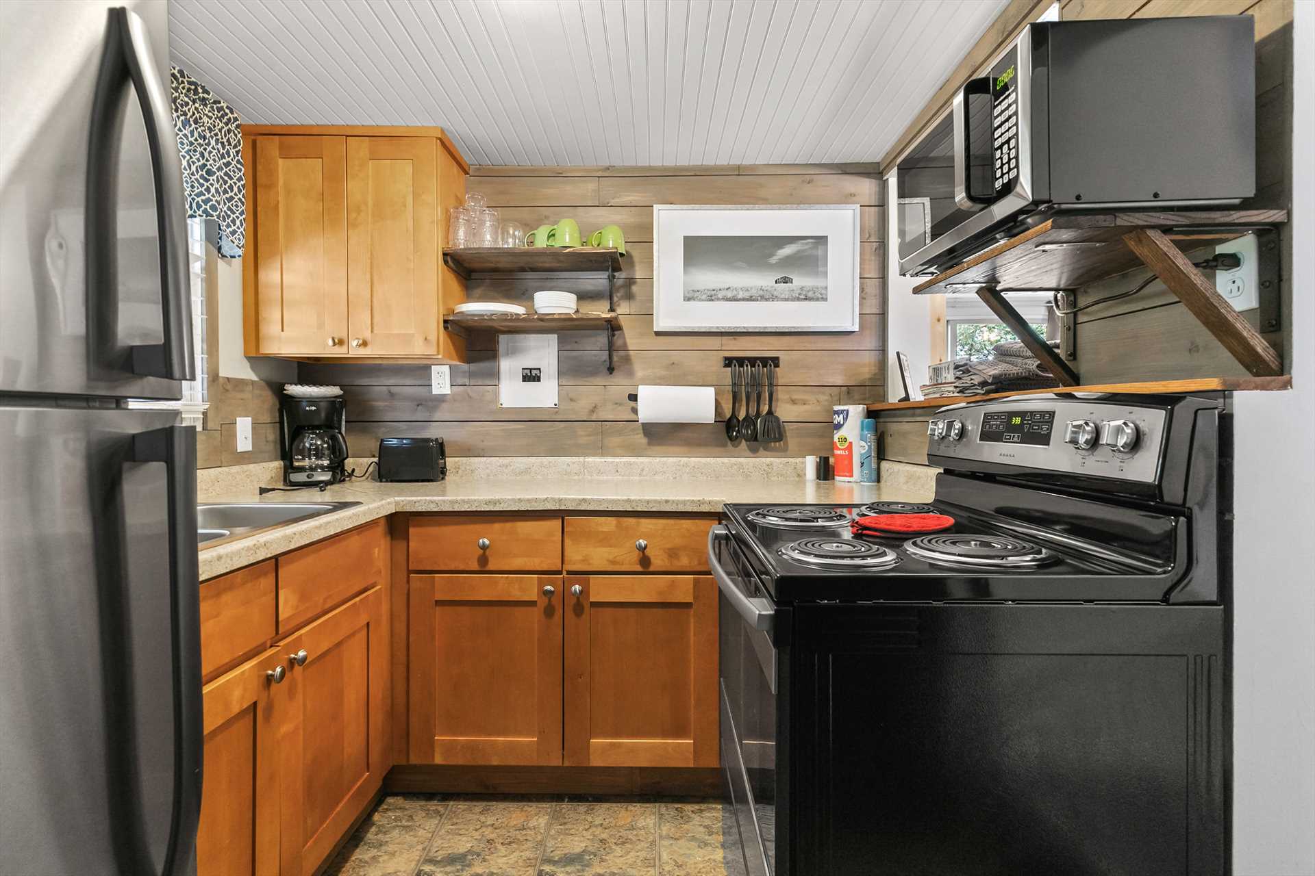 The kitchen has all stainless appliances.