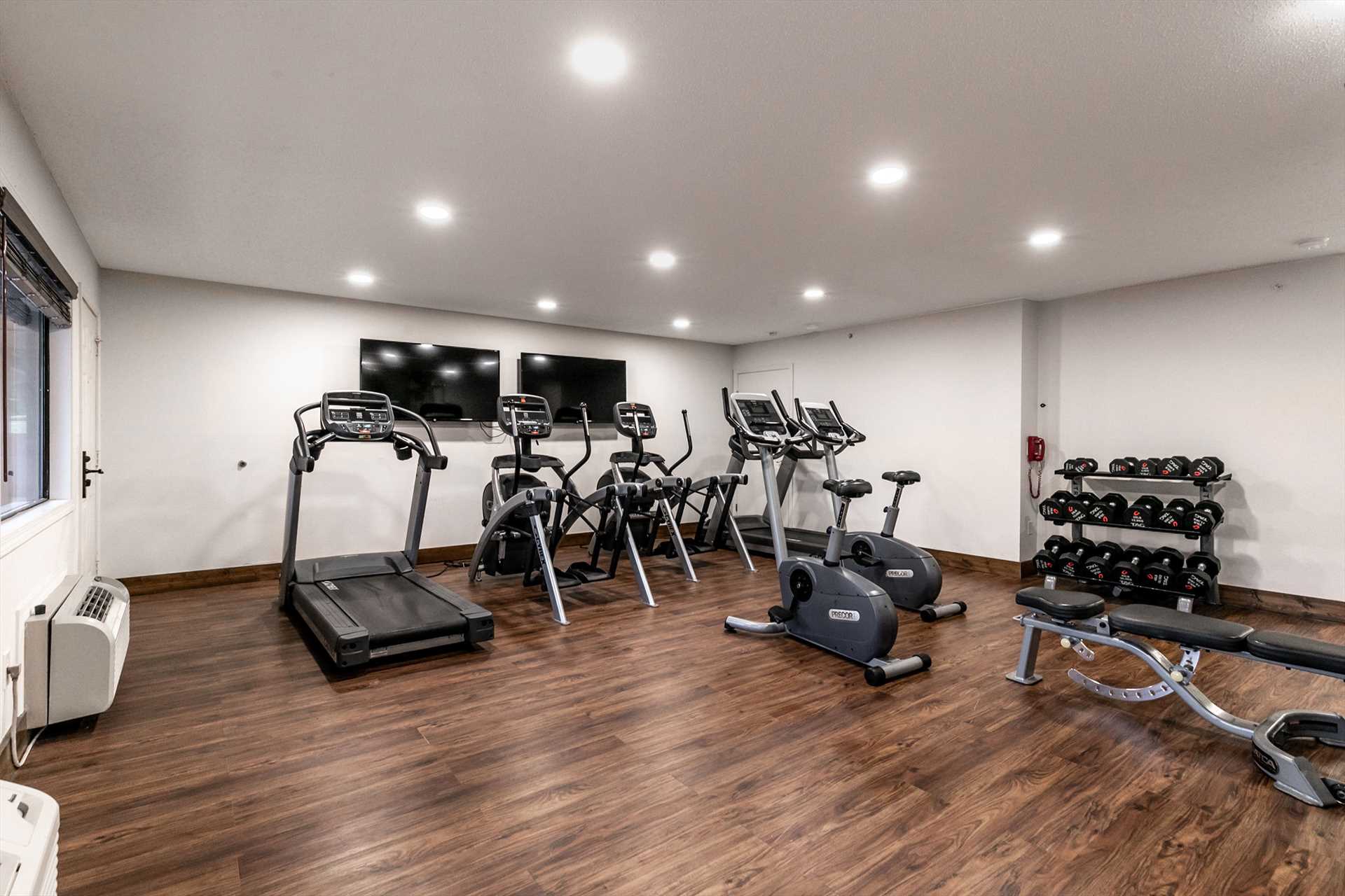 Nice workout area with cardio and weight lifting equipment.