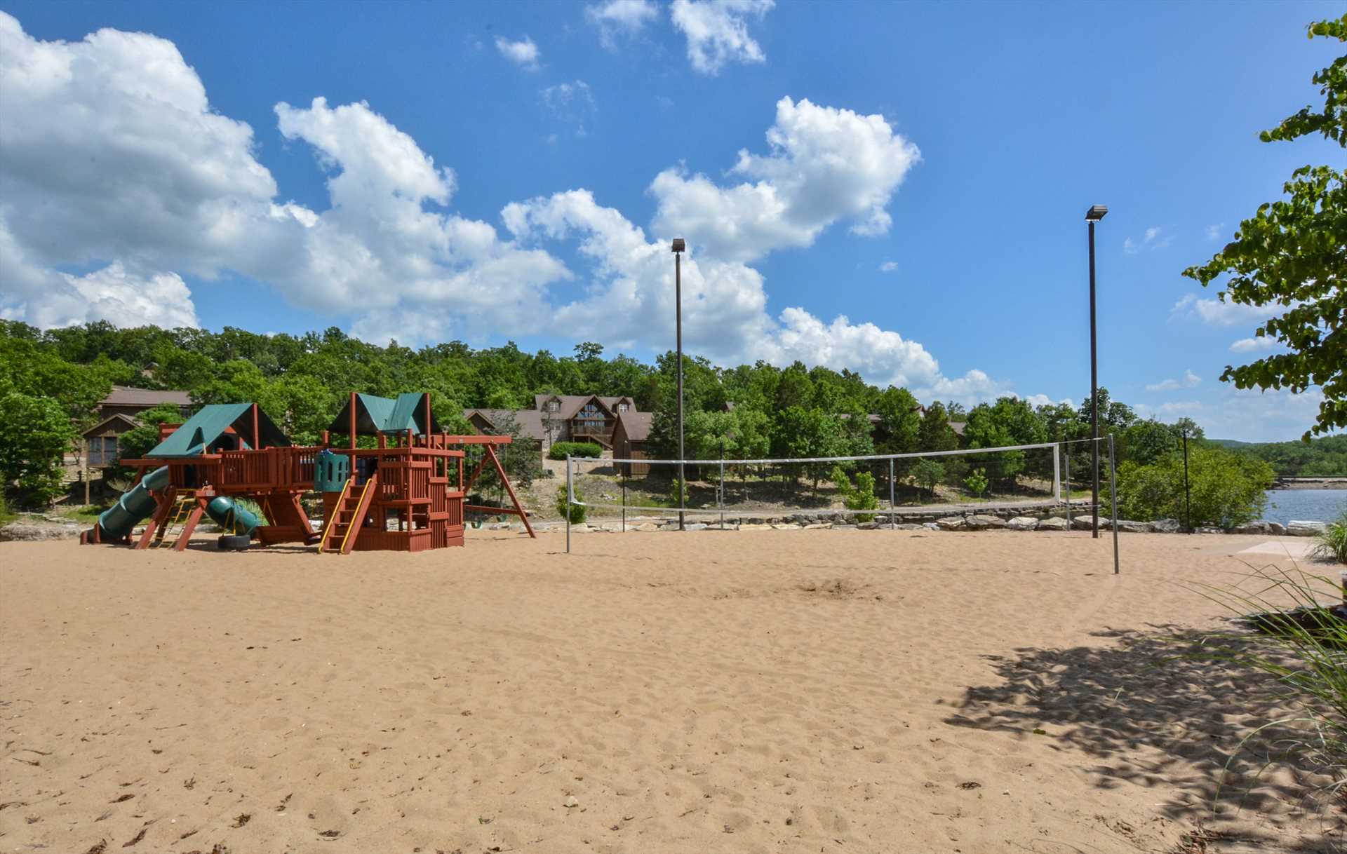 Sandy beach for volleyball right by the pool.