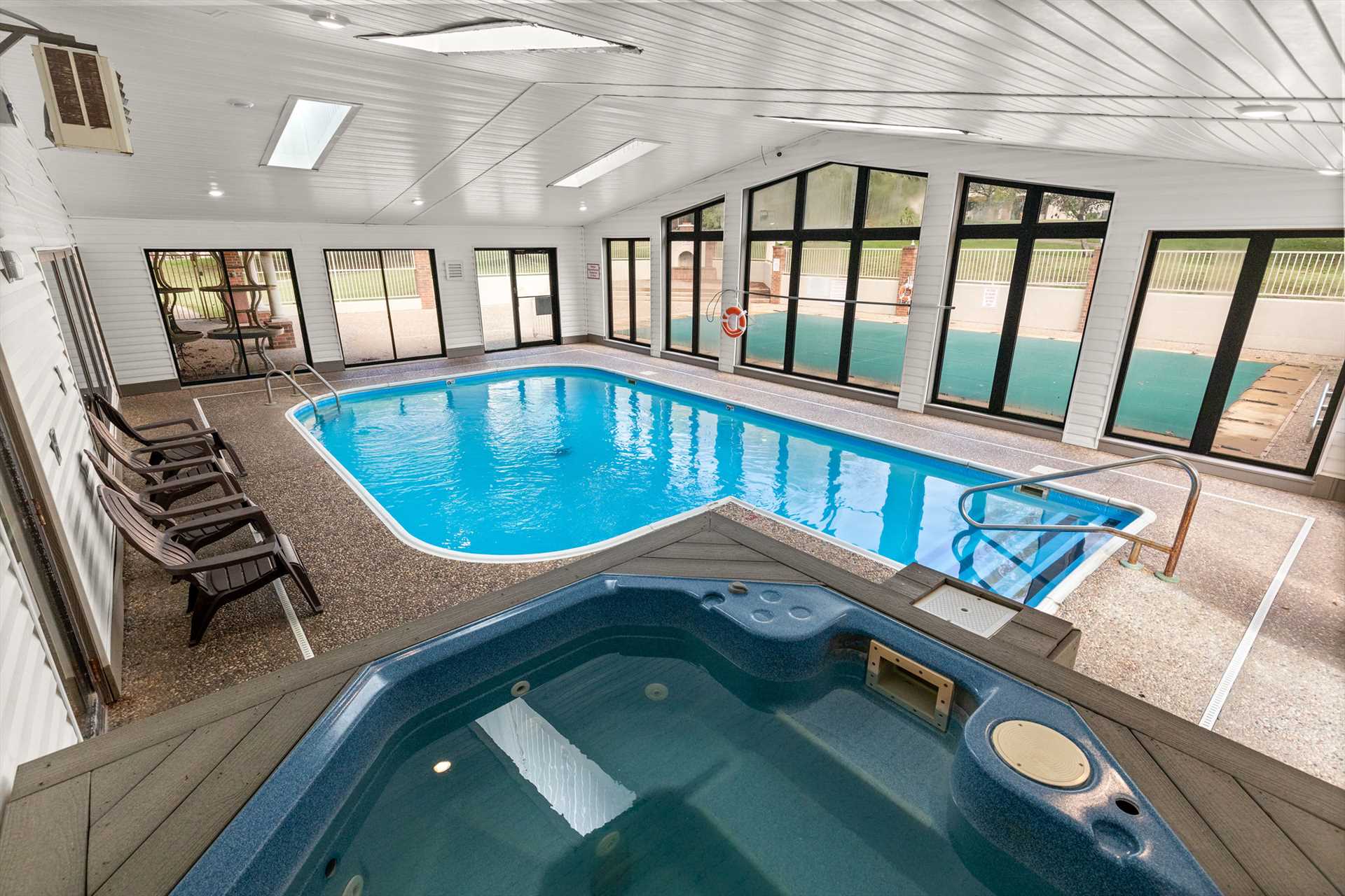 The hot tub overlooks the indoor pool