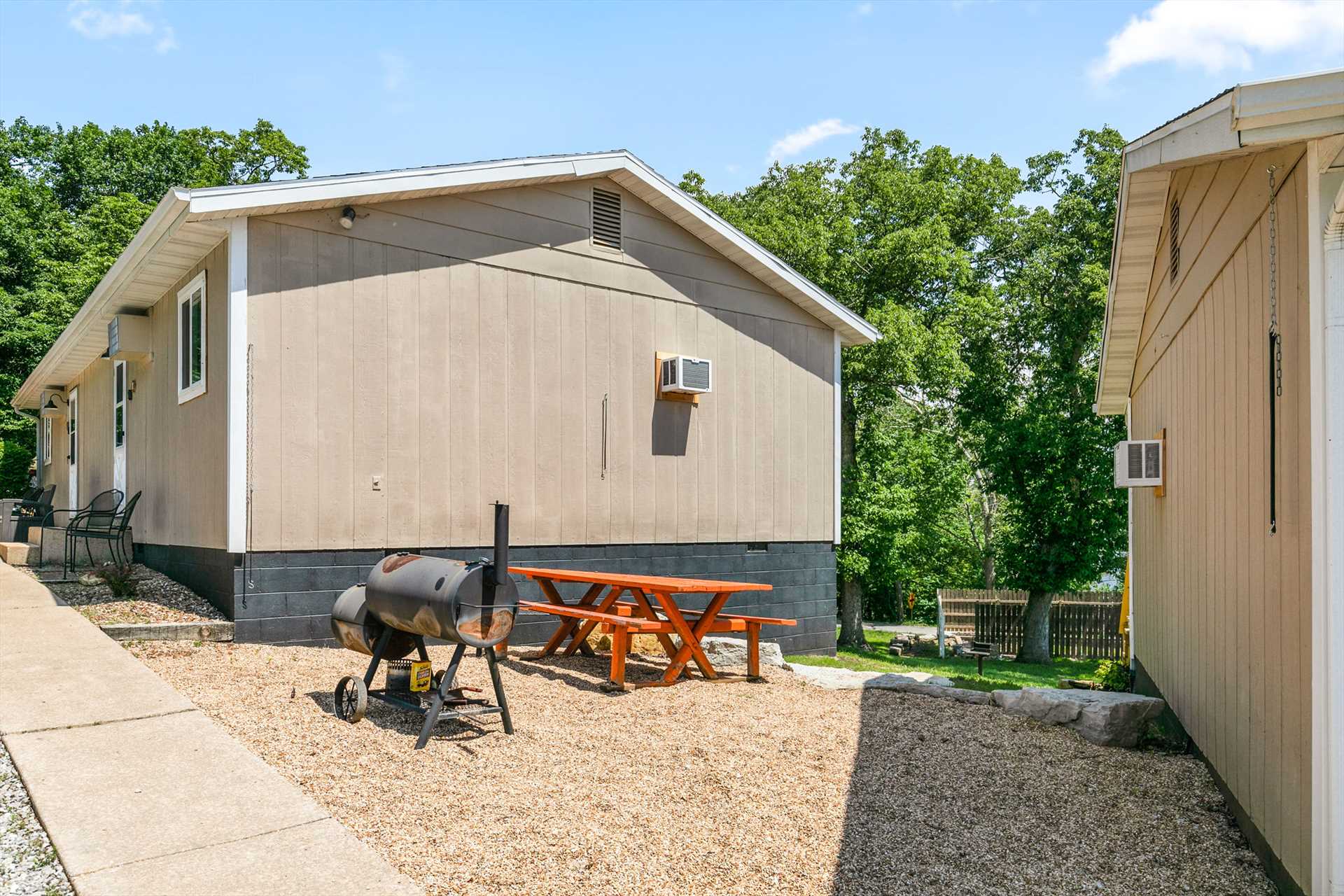 There is a gravel grill area located just outside the cabin.