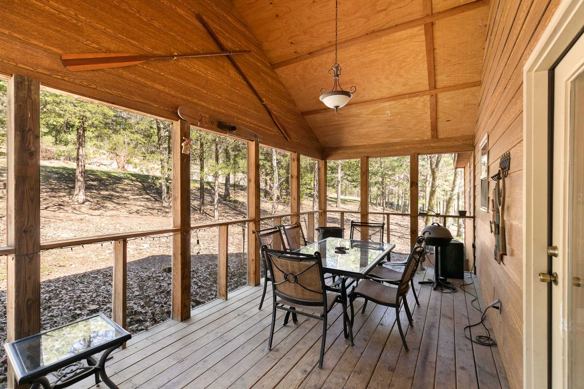 The outdoor screened-in porch, located off the dining area, 