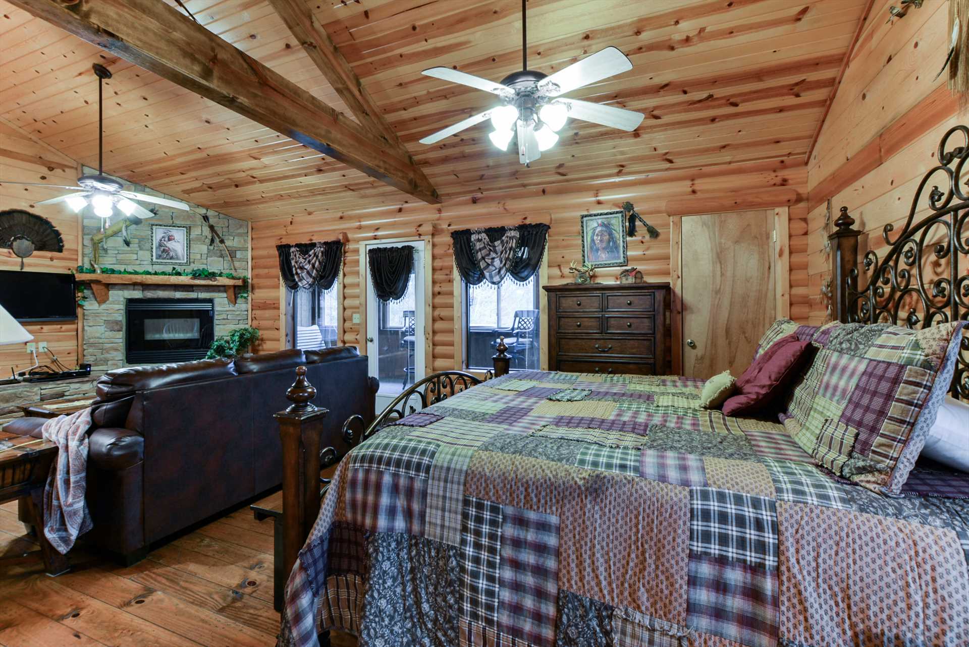 High ceilings and exposed wooden beams give the cabin a rust