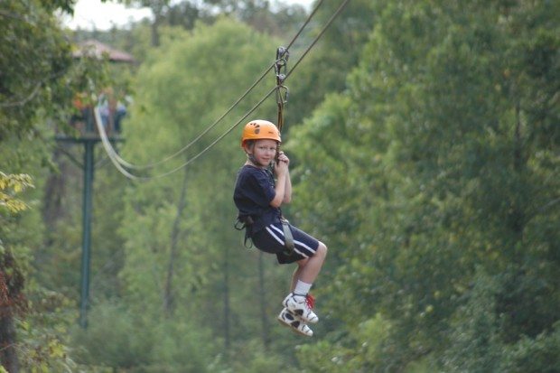 young boy on a zipline