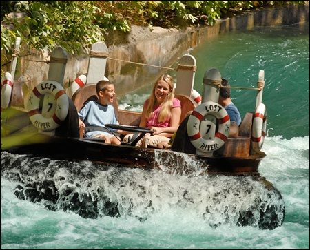 family on river rapids ride