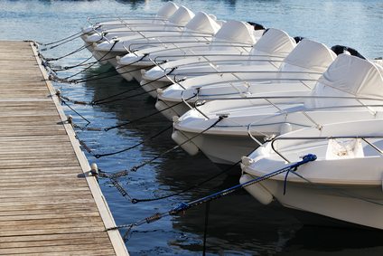 several boats tied to a dock