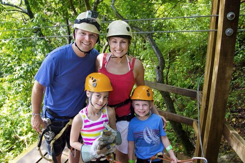 happy family going zip line