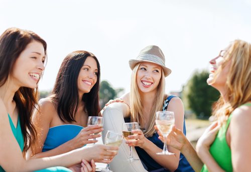 women with champagne glasses on boat