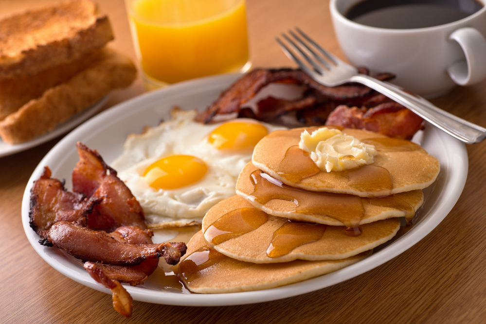 Breakfast with bacon, eggs, pancakes, and toast