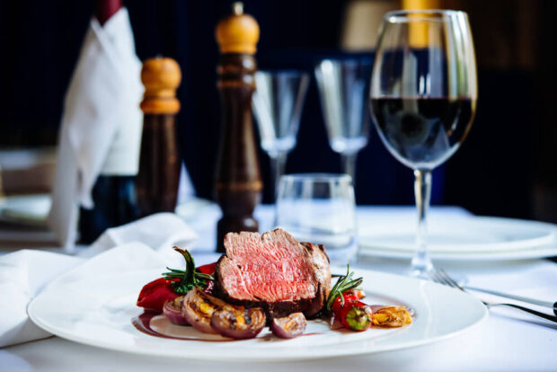 steak at a restaurant with a glass of wine. the best steak and seafood in Branson MO