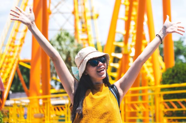 A woman excited about a Silver Dollar City roller coaster.