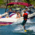 family hanging out on Table Rock Lake boat rental with water skier