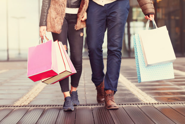 couple holding shopping bags