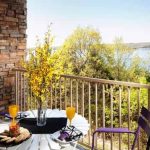 vacation home balcony with a table of brunch foods. View of Table Rock Lake