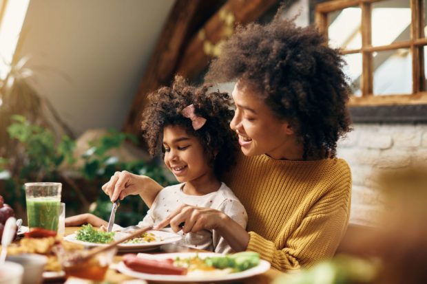 A girl and a woman enjoying a Breakfast in Branson, MO.